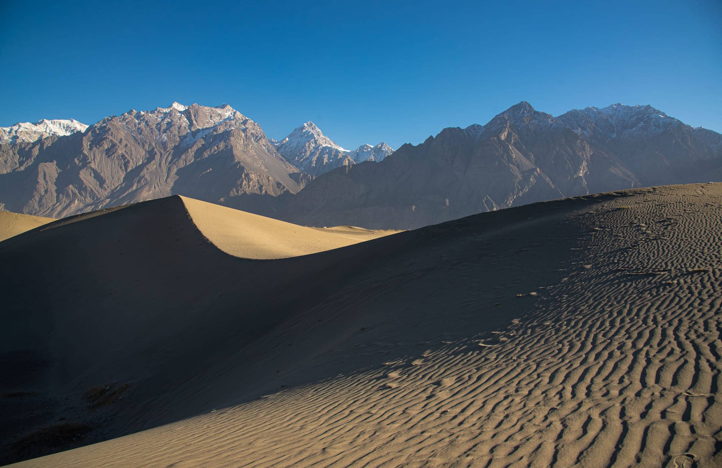 Skardu's cold desert sand dunes against the Karakoram